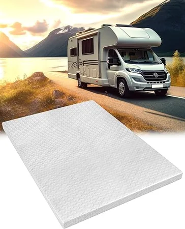 King size RV mattress topper setup in camper bedroom