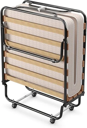 Space-saving KOMFOTT foldable bed set up for guest accommodation
