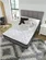 Hybrid mattress with pocketed coils and gel memory foam for back support