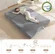 BYBYME foldable mattress topper being carried for easy storage and transport
