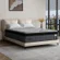 Queen size mattress with 10 year warranty shown in bedroom setup