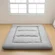 Gray INFINICE Japanese floor futon mattress rolled up with storage bag