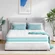 TeQsli twin size hybrid mattress being unboxed from its compact box