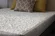 Premium textured 8-way stretch cover on Travel Happy mattress